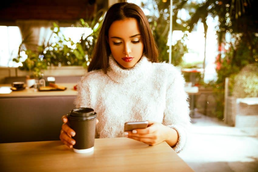 woman sad coffee phone
