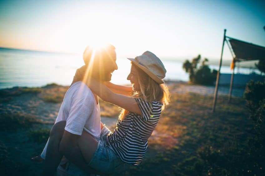couple sunset beach