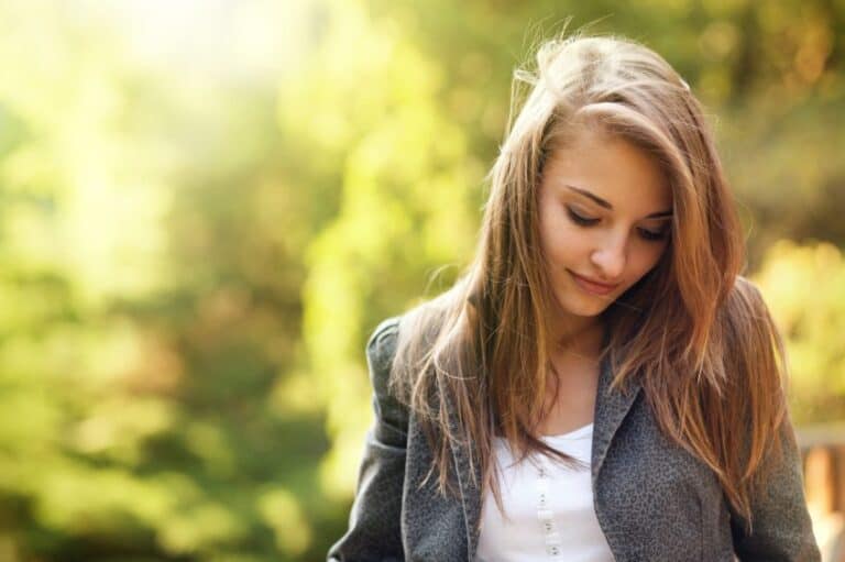 Long haired brunette in field