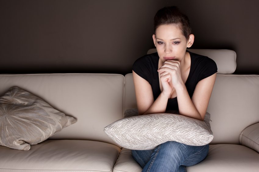 Young woman watching TV.