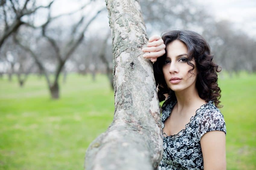 Young girl in spring park, focus on face
