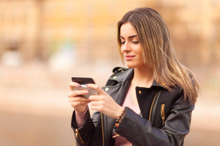 Young woman texting