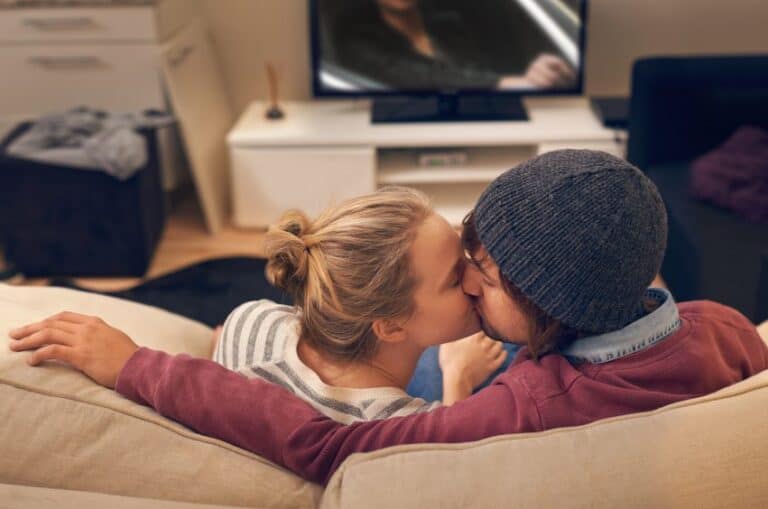 Couple couch kissing