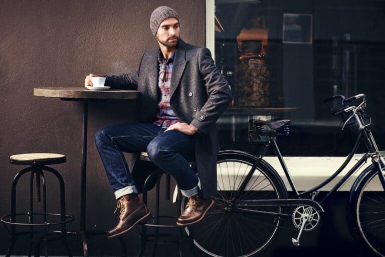 Young man sat drinking coffee