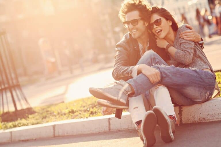 Loving couple sunset sitting