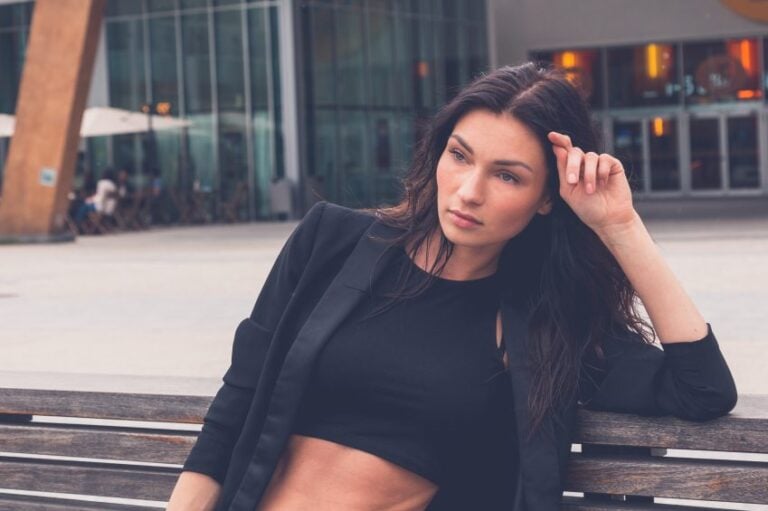 Beautiful girl posing on a bench