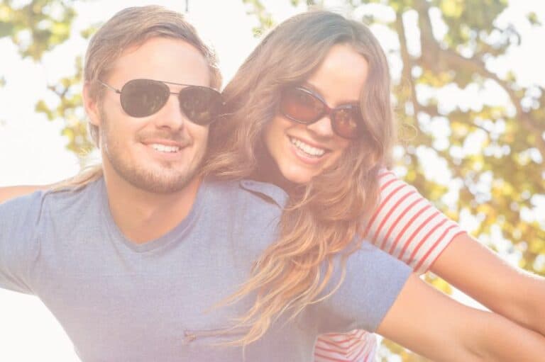 Young couple laughing outside