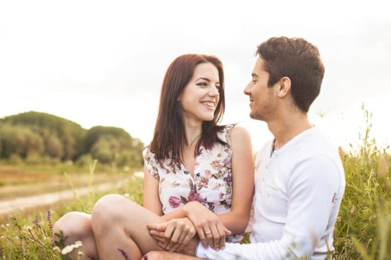 Loving couple in a field outdoors