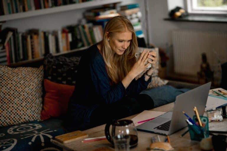 Woman sat looking at laptop