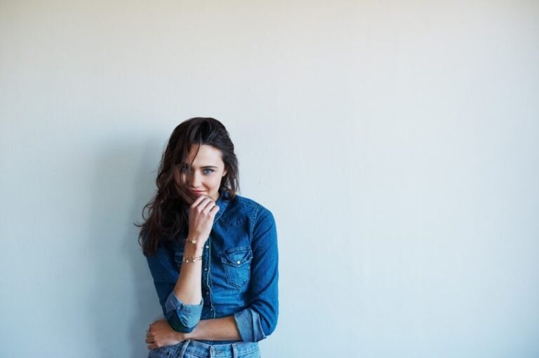 woman smirking portrait denim white