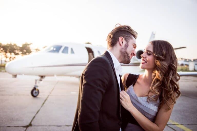 Guy going in for a kiss at the airport