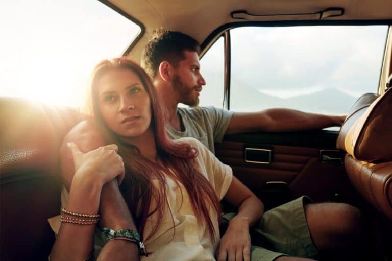 Young adult couple in car