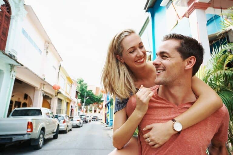 Young couple piggy backing