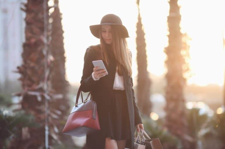 Woman with hat and shopping bags