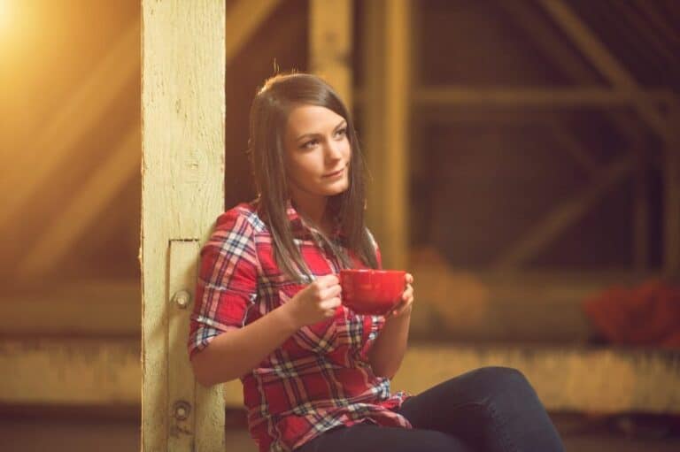 Young brunette with coffee cup