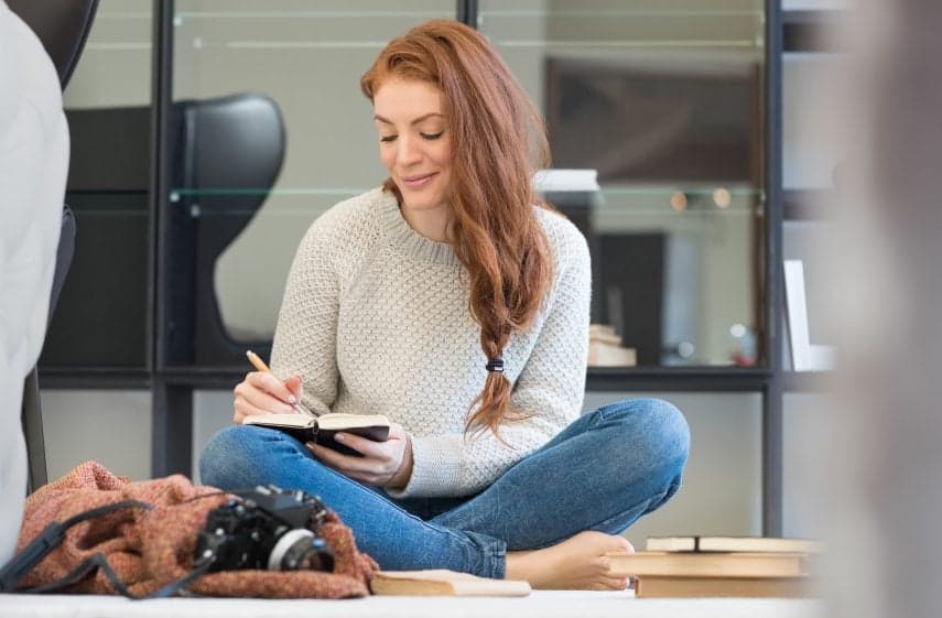 happy woman writing smiling