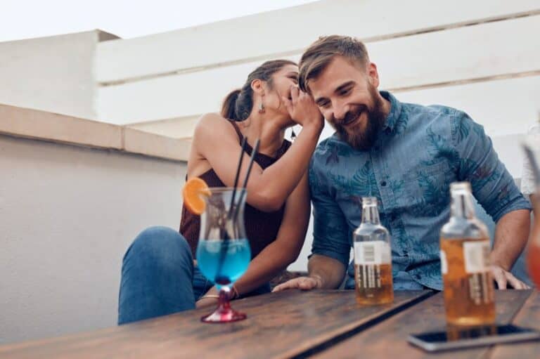 woman whispering couple love