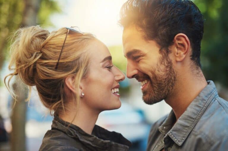 Loving couple smiling sunset