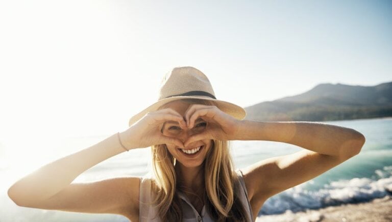 Young happy blonde beach