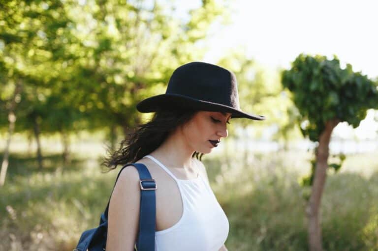 woman hat field walking