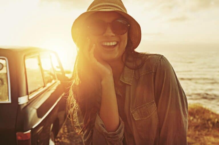 Brunette sunglasses sunset