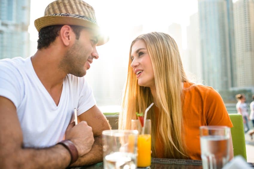 Couple enjoying cocktails on holiday