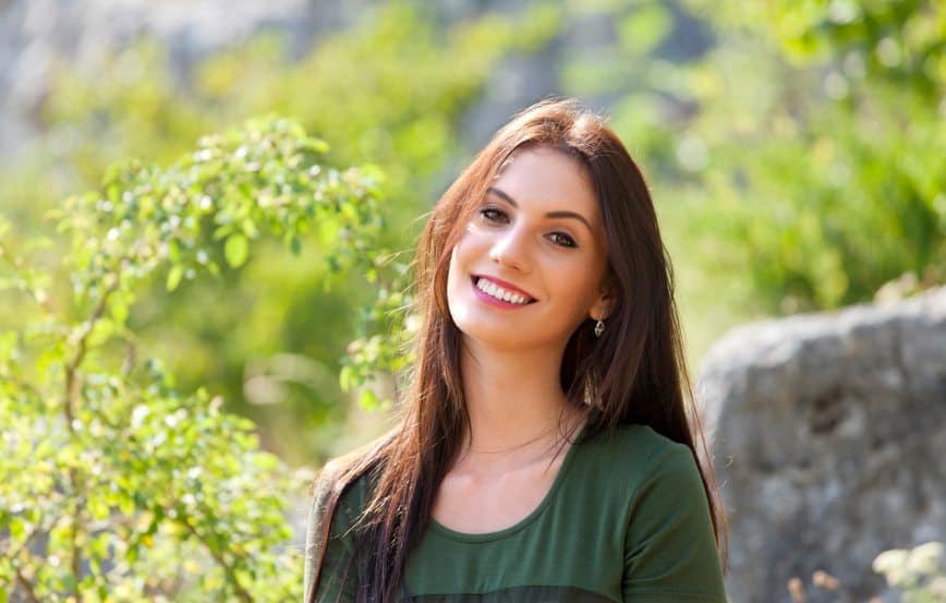 Brunette smiling in nature