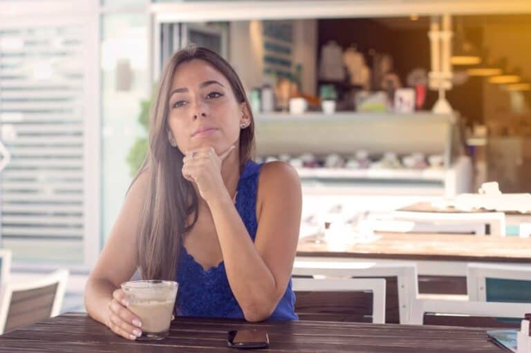 Brunette sat alone cafe