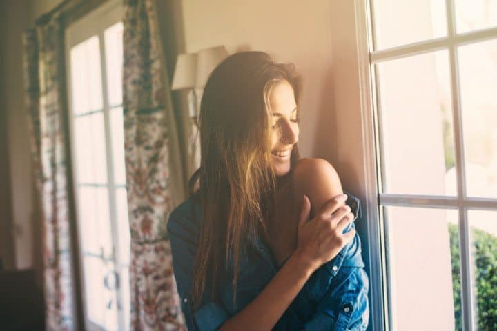 Beautiful brunette near window