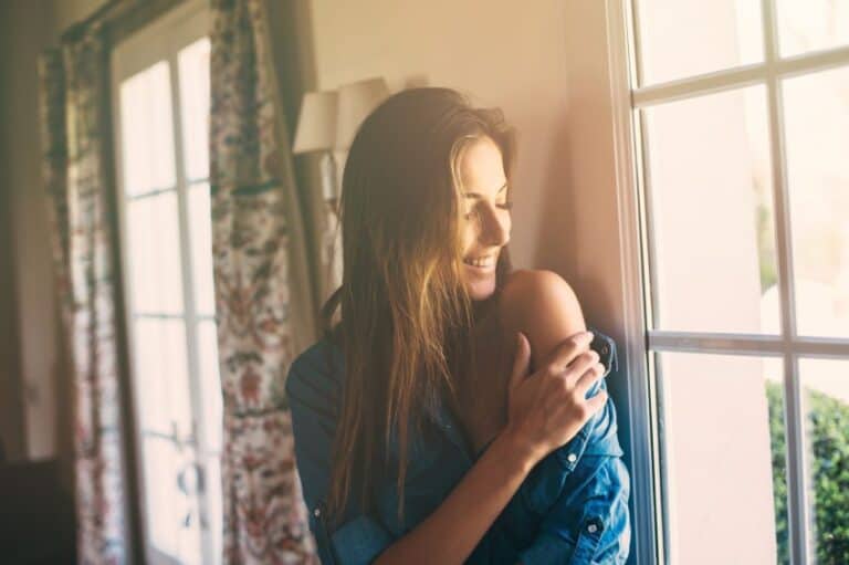 Beautiful brunette near window