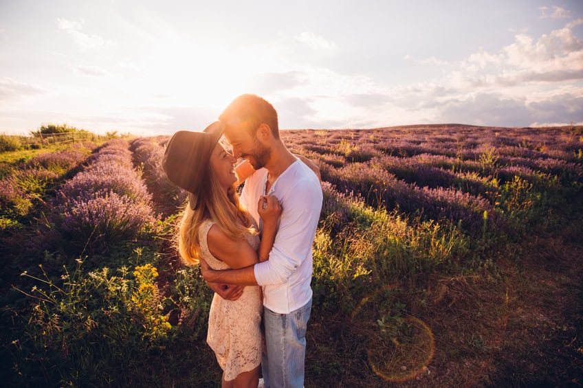 Photo of happy couple enjoying in their love at the lavender field