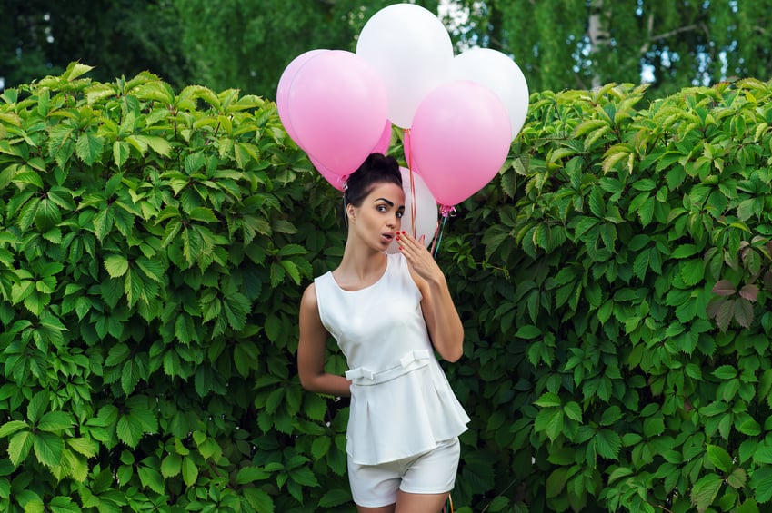 Woman holding pink.