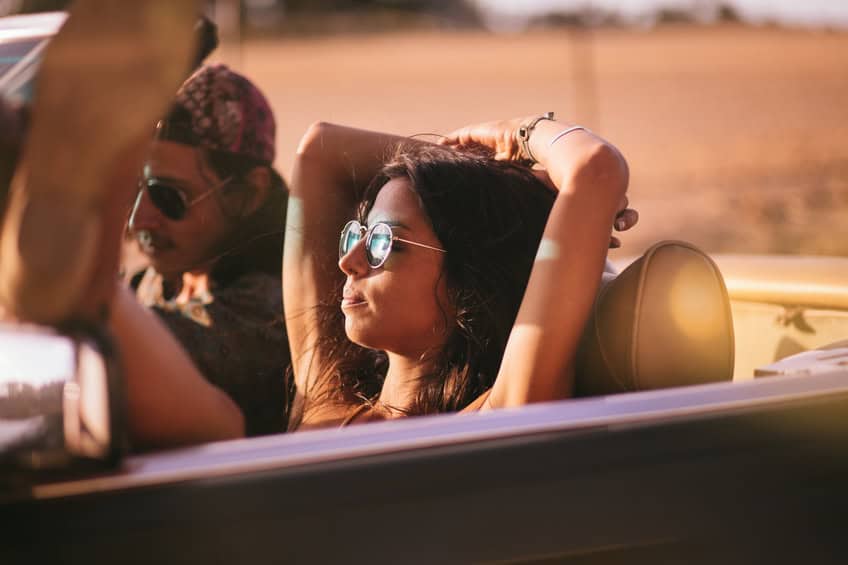Boho style teenage girl lovers enjoys a summer road trip