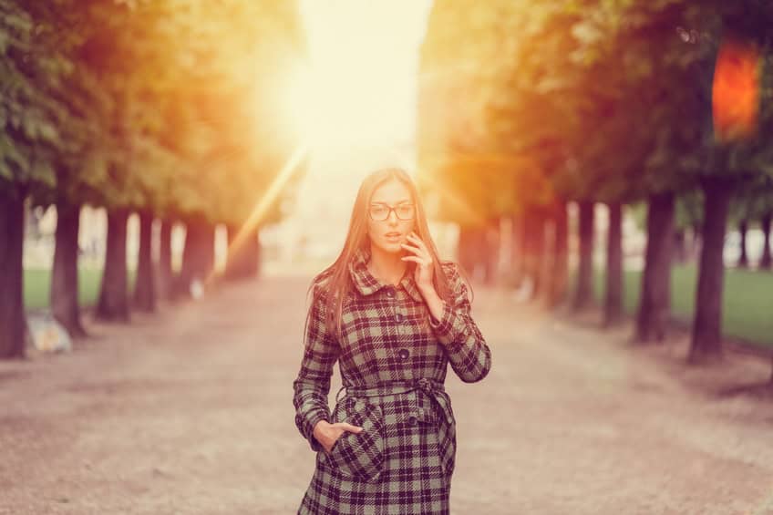 Young woman in the park looking surprised