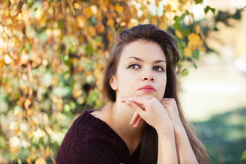 Young girl outside in autumn