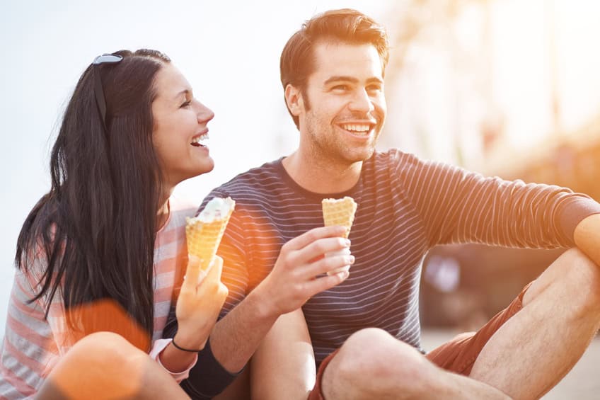 Loving couple sat icecream
