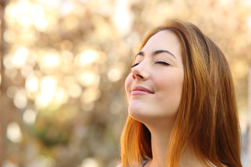 Woman doing breath exercises.