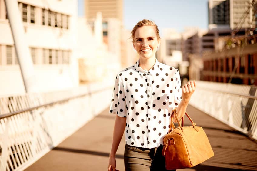 Young woman walking confidently