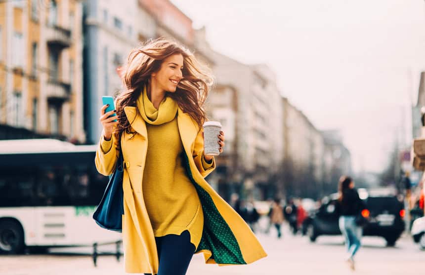 Confident woman walking outside