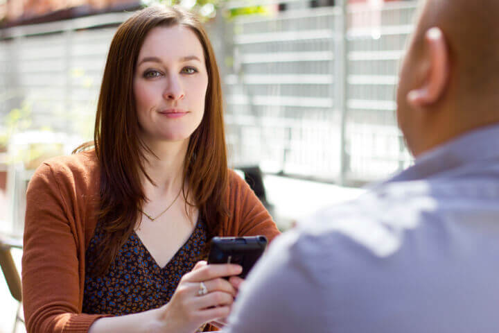 bored incompatible couple on an outdoor date outdoors