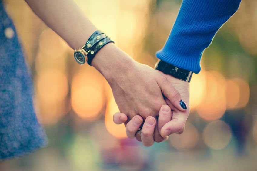 Couple holding hands
