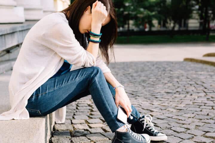 Young woman sat alone