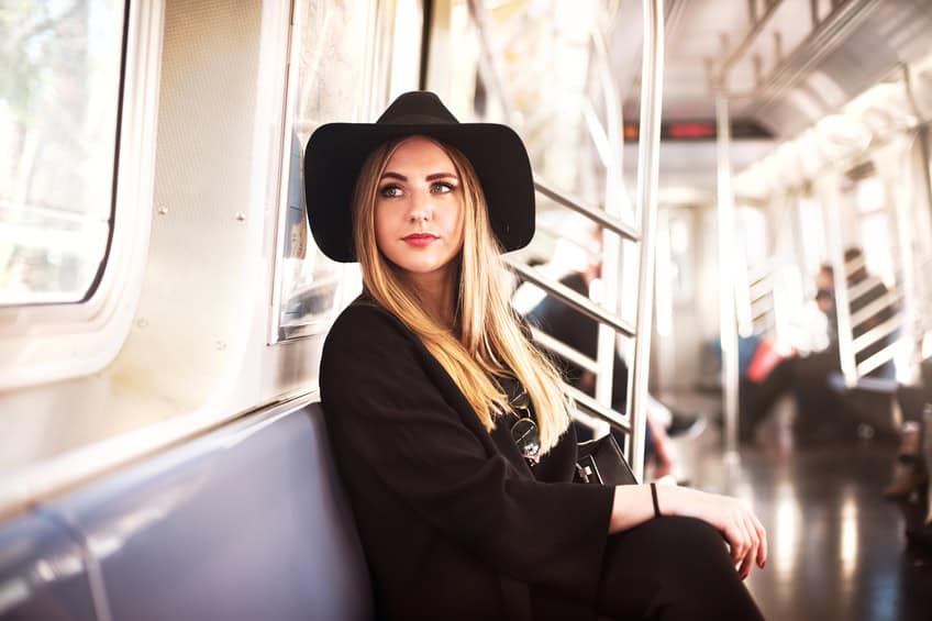 woman train happy commute NYC, subway
