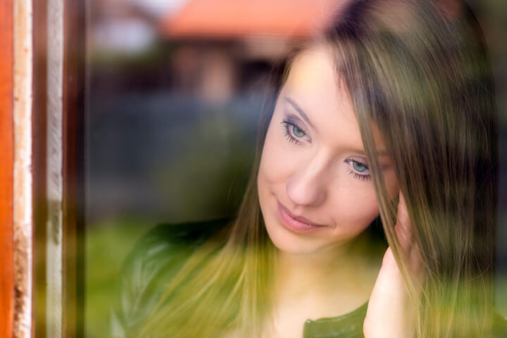 Girl looking out of the window