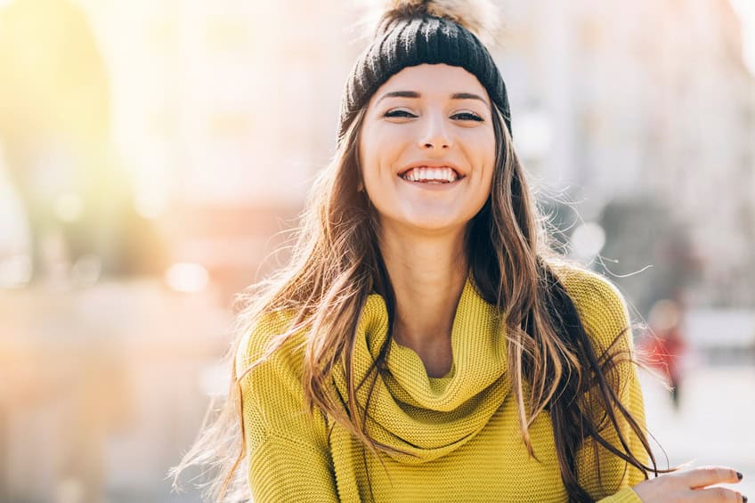 smiling woman with beanie hat