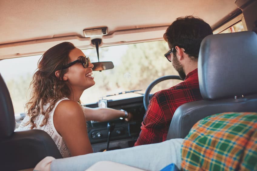 Young couple enjoying a road trip