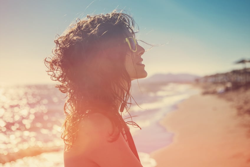 portrait of young beautiful woman on sunny summer day