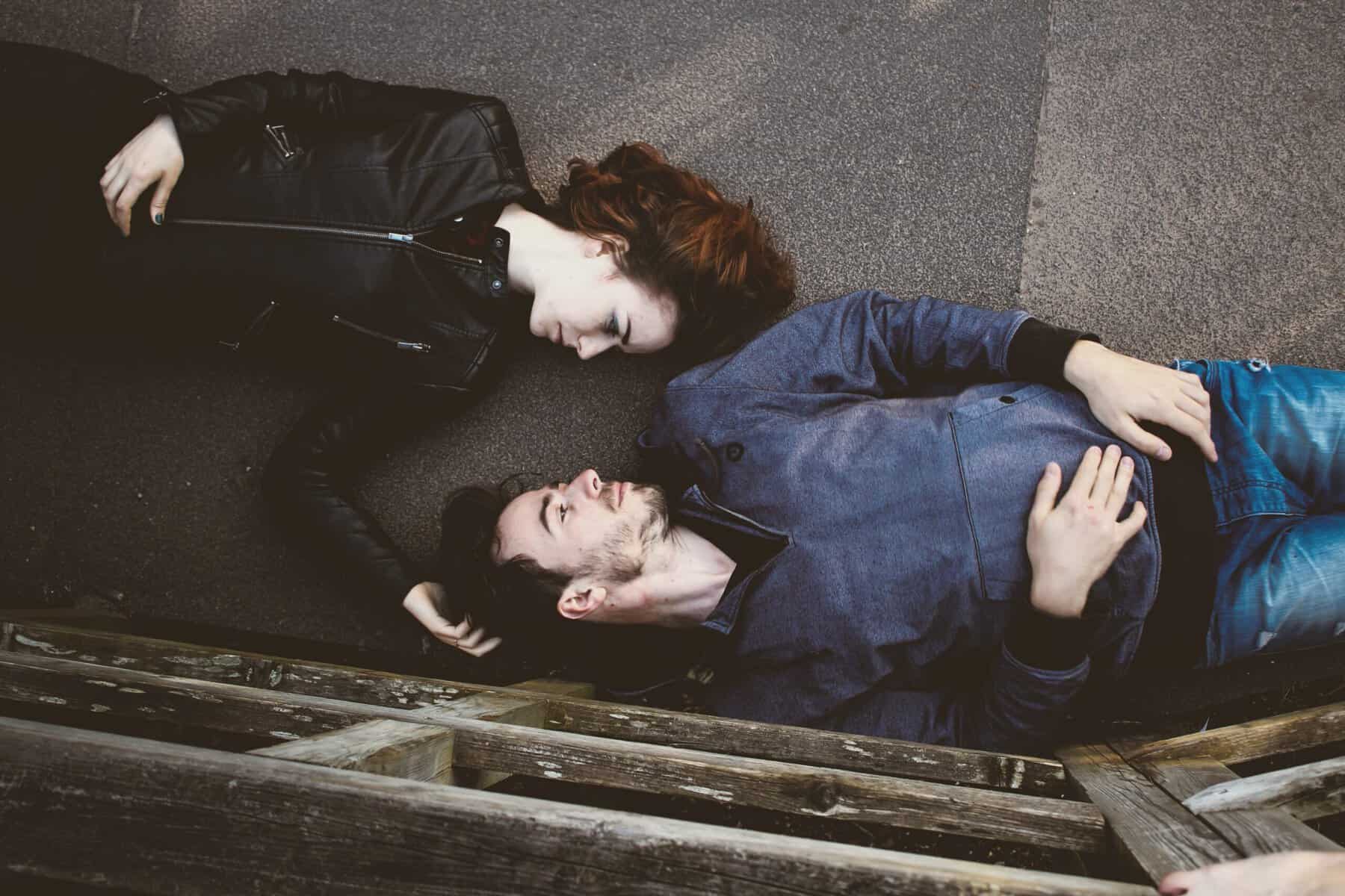 couple lying down street