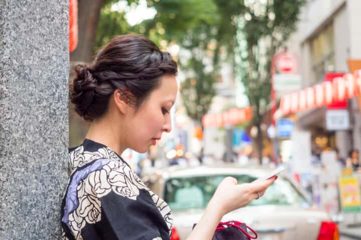 woman phone city outside