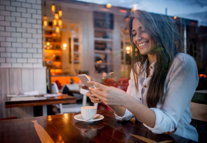 woman texting cafe restaurant
